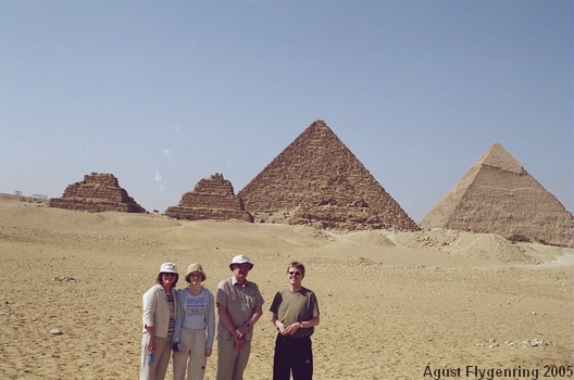 The whole family poses with the Pyramids
