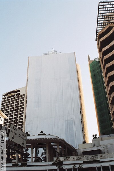 The front of the Intercontinental Phoenician tower, which has been covered for restoration after the Feb. blast