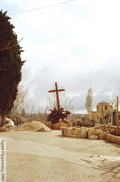 A cross in front of a church near the temple area