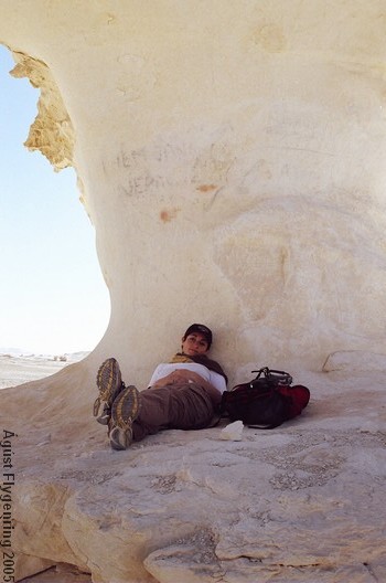 Simo chills under a graffiti ridden rock in the White Desert